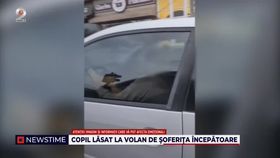 VIDEO O șoferiță începătoare a fost surprinsă cu copilul la volan în una dintre cele mai mari intersecții din Capitală